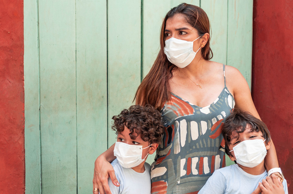 Image of mother with children in surgical masks